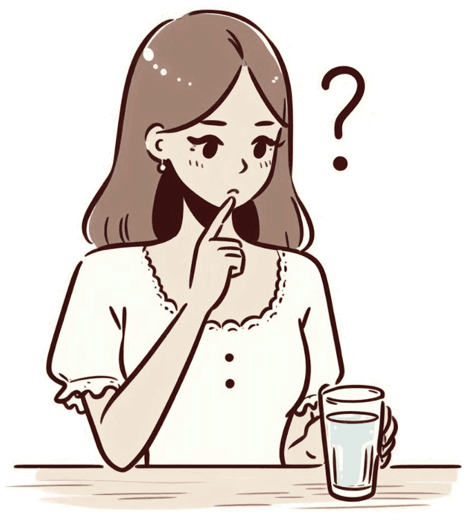 コップに入った水を見て、硬水と軟水について疑問に思う女性。